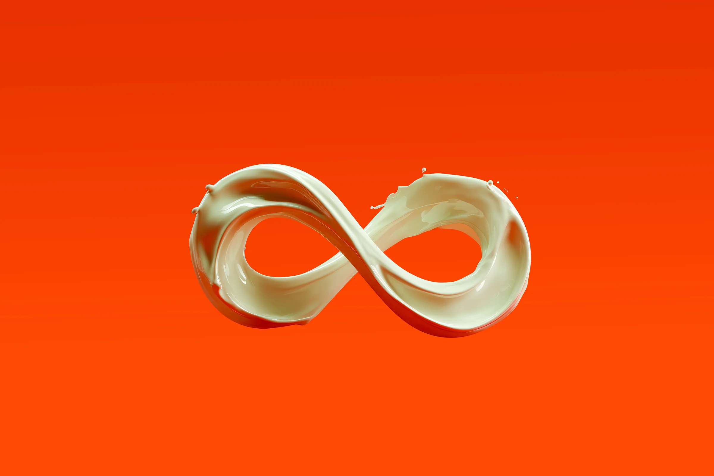Splash of milk frozen in the shape of an infinity symbol against an orange background